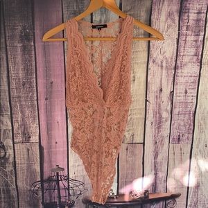 Light pink lace body suit